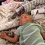 Hudson is registered to the contest to win money with this photo: baby, bed, bedroom, blanket, bodypart, clothing, couch, cushion, face, finger, furniture, hand, head, homedecor, indoors, linen, newborn, person, quilt, room