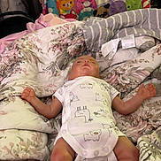 Hudson is registered to the contest to win money with this photo: accessories, baby, bag, bed, bedroom, blanket, bodypart, couch, crib, cushion, finger, furniture, hand, handbag, homedecor, indoors, infantbed, newborn, person, room