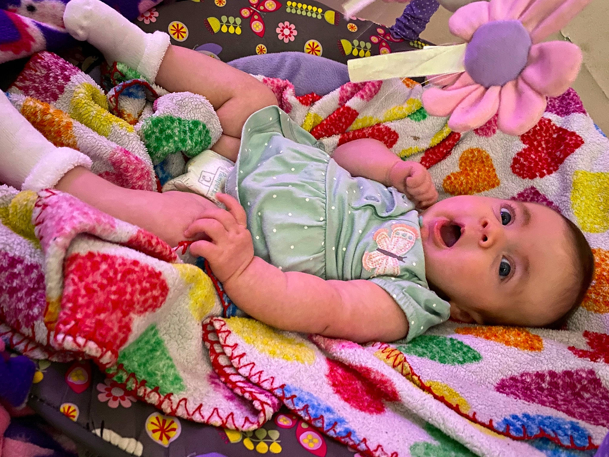 Georgia is registered to the contest to win money with this photo: baby, baby_products, baby_toddler_clothing, baby_toys, bed_sheet, bedding, child, comfort, doll, linens, magenta, pattern, person, pink, room, stuffed_toy, surprise, sweetness, textile, toddler