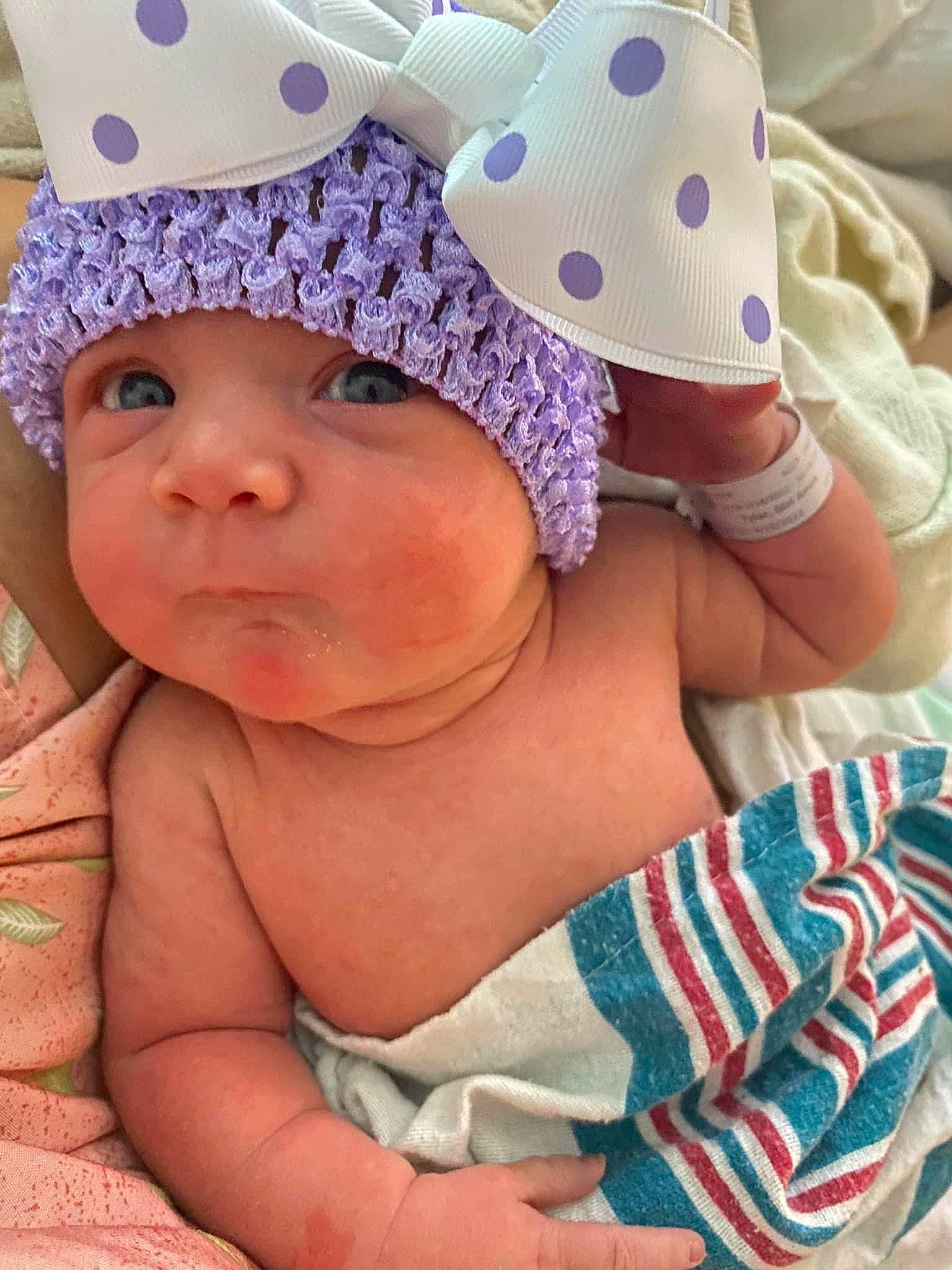 Georgia is registered to the contest to win money with this photo: baby, baby_sleeping, baby_toddler_clothing, cap, child, comfort, costume_hat, happy, hat, headgear, headwear, linens, magenta, party_supply, pattern, person, pink, purple, skin, textile