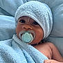 Connor a rejoint le concours — aidez-le/la à gagner de superbes lots ! baby, towel, pacifier, face, child, skin, hand, blue, soft, portrait, indoors, cute, wrapped, headwear, infant, expression, closeup, newborn, resting, relaxed
