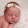 baby, newborn, sleeping, face, headband, flower, skin, pillow, pattern, closeup, peaceful, infant, resting, portrait, soft, cute, child, hands, delicate, calm