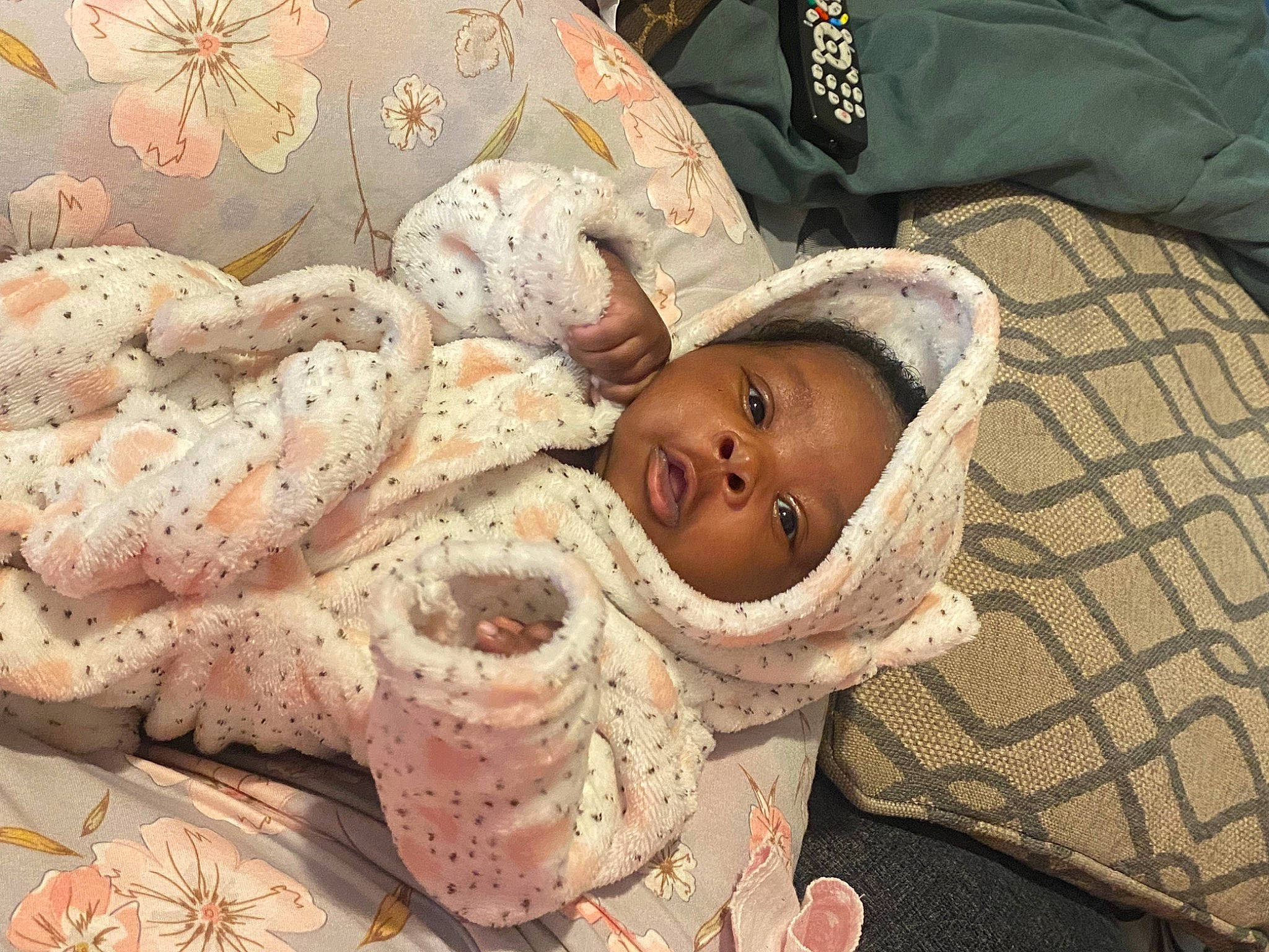 Ariah joined the competition — help win amazing prizes! baby, baby_products, baby_toddler_clothing, bedding, child, comfort, event, eye, face, fashion_accessory, fur, hat, head, headgear, linens, pattern, person, shawl, smile, toddler