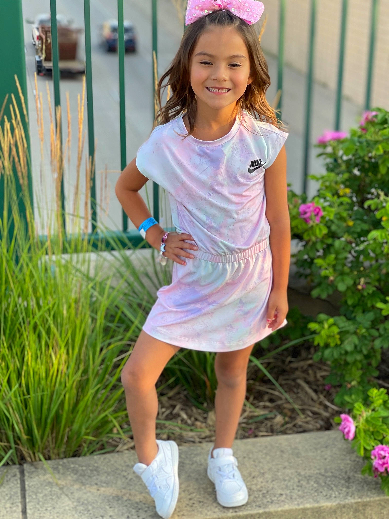 Haizlee is registered to the contest to win money with this photo: child, day_dress, dress, electric_blue, face, flower, grass, happy, joy, leisure, magenta, people_in_nature, person, pink, plant, sleeve, smile, street_fashion, summer, toddler