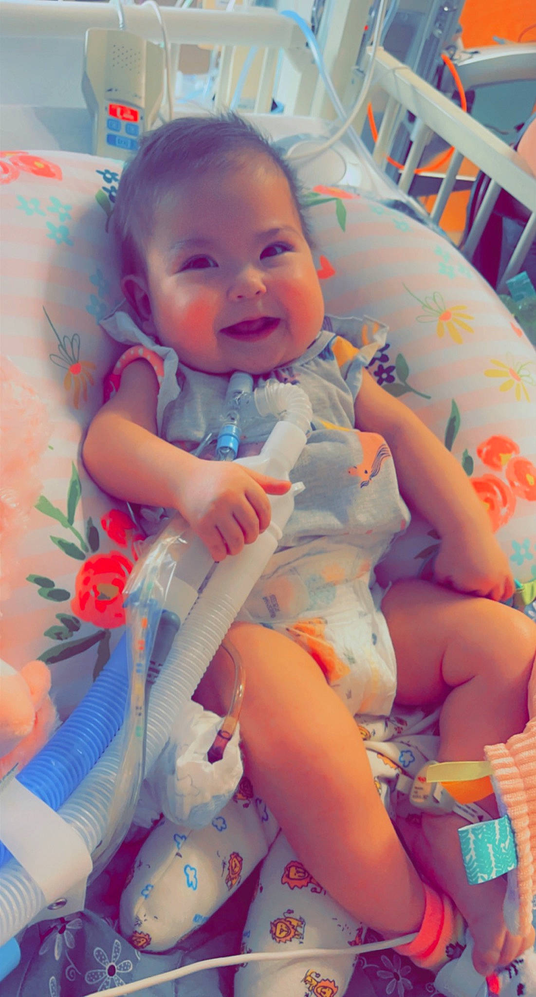 Rory is registered to the contest to win money with this photo: arm, baby, baby_toddler_clothing, cheek, child, comfort, eye, finger, fun, happy, human_body, joy, mouth, nail, person, pink, skin, smile, textile, thigh