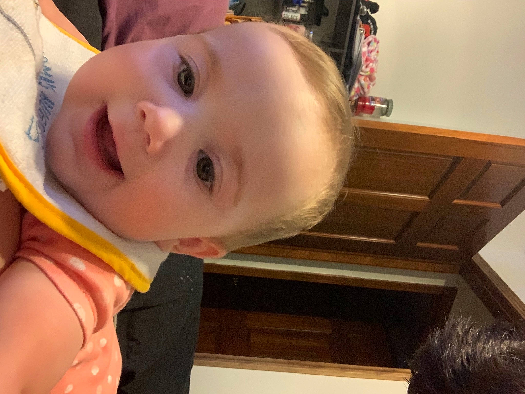 Sophia is registered to the contest to win money with this photo: arm, baby_toddler_clothing, cheek, chin, dress, eye, eyelash, facial_expression, finger, happy, head, human_body, iris, lip, mouth, neck, nose, person, skin, smile