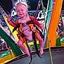 Djayan participe au concours pour gagner de l'argent avec cette photo : toddler, child, trampoline, harness, nighttime, carnival, fair, colorful, lights, play, fun, smile, hair, pony_tail, clothing, safety, amusement_park, metal_structure, rope, outdoor