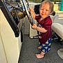 Edward joined the competition — help win amazing prizes! toddler, child, boat, steering_wheel, barefoot, carpet, dashboard, outdoor, water, smiling, clothing, shorts, shirt, nature, sunlight, happy, person, portrait, recreation, vacation
