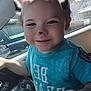 child, toddler, smile, face_filter, animal_ears, animal_nose, car_interior, steering_wheel, blue_shirt, daylight, window, seat, dashboard, hand, cute, happy, portrait, vehicle, young_child, playful