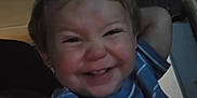 Edward joined the competition — help win amazing prizes! toddler, child, smiling, blue_shirt, striped_clothing, indoor, face, happy, person, young_child, short_hair, playful, reaching_hand, dim_lighting, portrait, cute, casual, infant, baby, expression