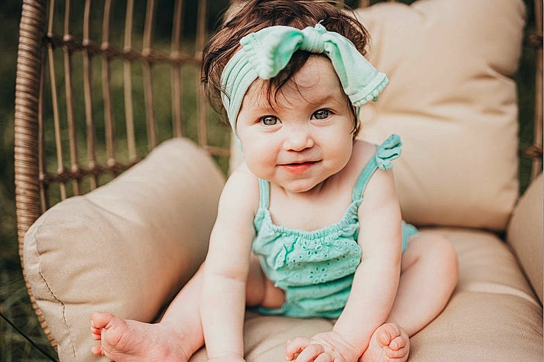 Kynsley is registered to the contest to win money with this photo: baby, beauty, cheek, child, child_model, eye, face, facial_expression, hair_accessory, headband, headgear, headpiece, headwear, person, photograph, photography, portrait, portrait_photography, sitting, skin