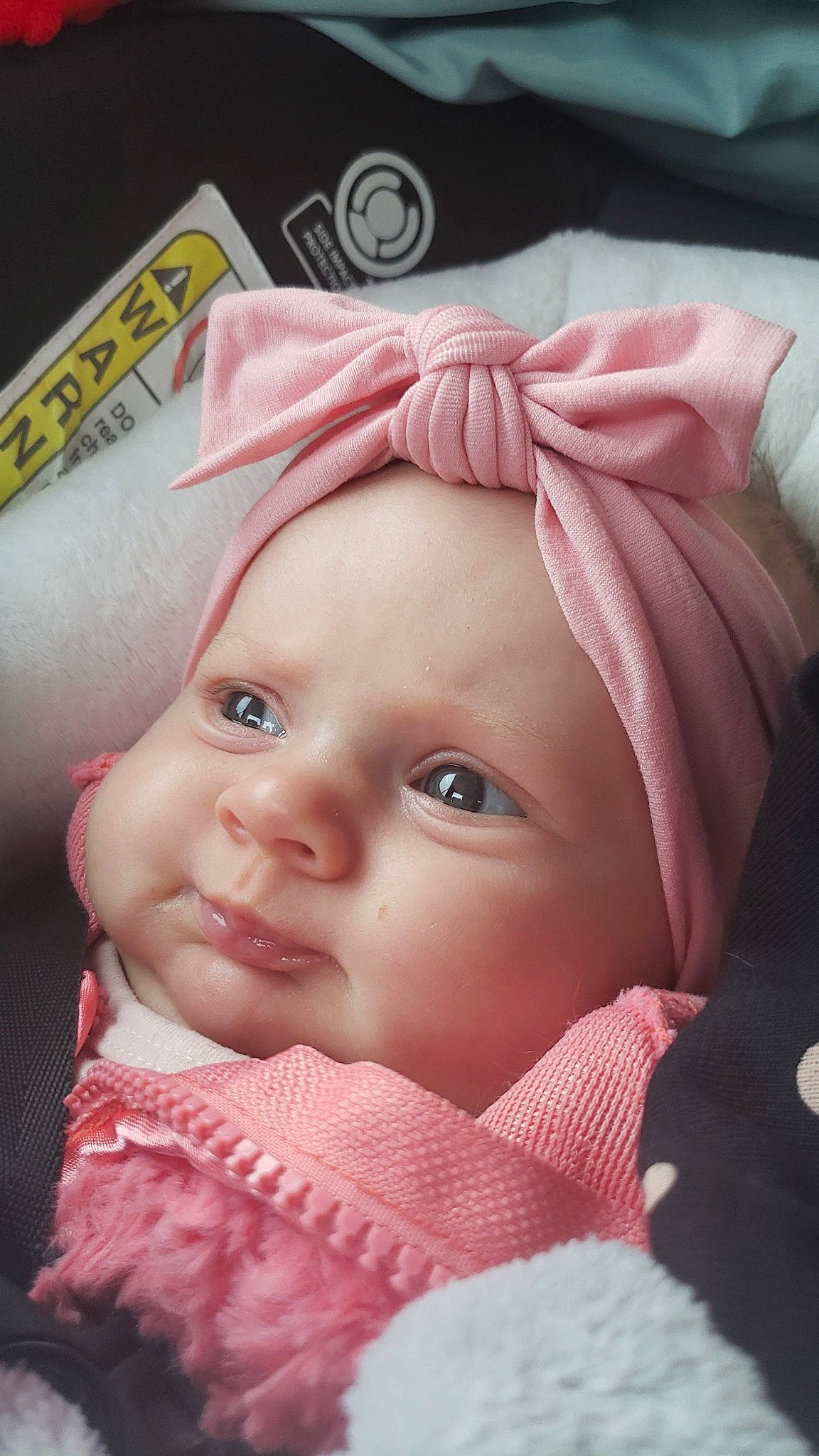 Monica is registered to the contest to win money with this photo: baby, cheek, chin, eye, eyebrow, eyelash, face, forehead, happy, headgear, headwear, iris, lip, magenta, mouth, nose, person, pink, skin, smile