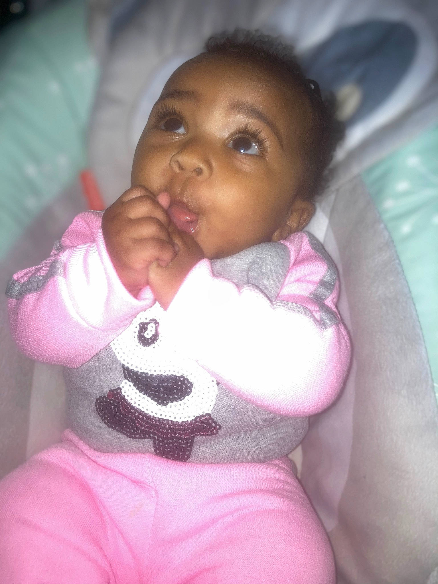 Analaya is registered to the contest to win money with this photo: arm, baby_toddler_clothing, cheek, chin, comfort, ear, eyebrow, facial_expression, hand, human, human_body, joint, lip, mouth, neck, nose, person, product, purple, skin