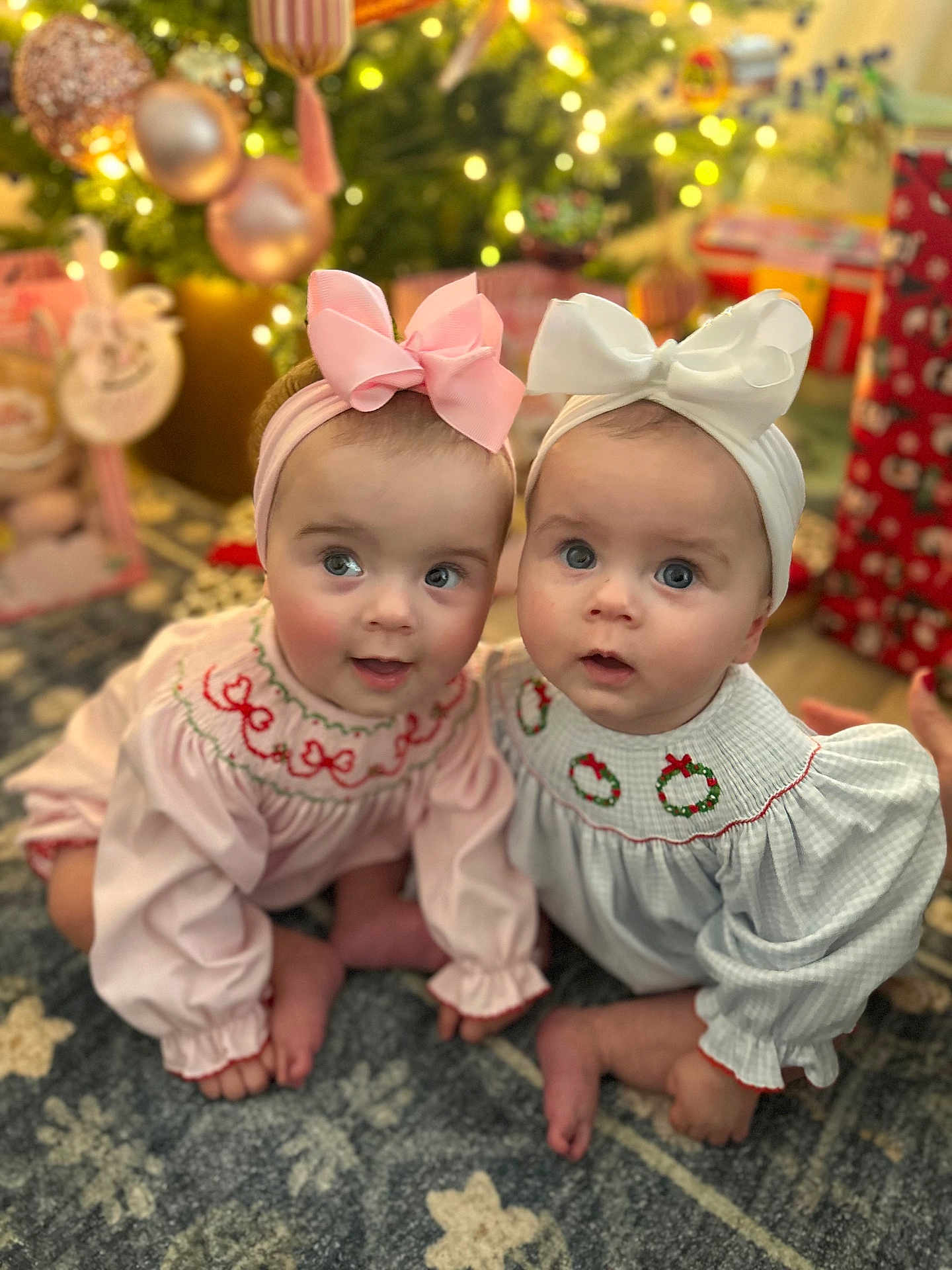 Sunday joined the competition — help win amazing prizes! baby, babies, child, infant, headband, bow, christmas_tree, holiday, presents, carpet, floor, indoors, cute, portrait, smiling, festive, decorations, light, sitting, clothing