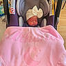 newborn, baby, infant, sleeping, car_seat, blanket, pink, bow, hat, portrait, face, closed_eyes, indoors, home, floor, furniture, cozy, resting, child, photography