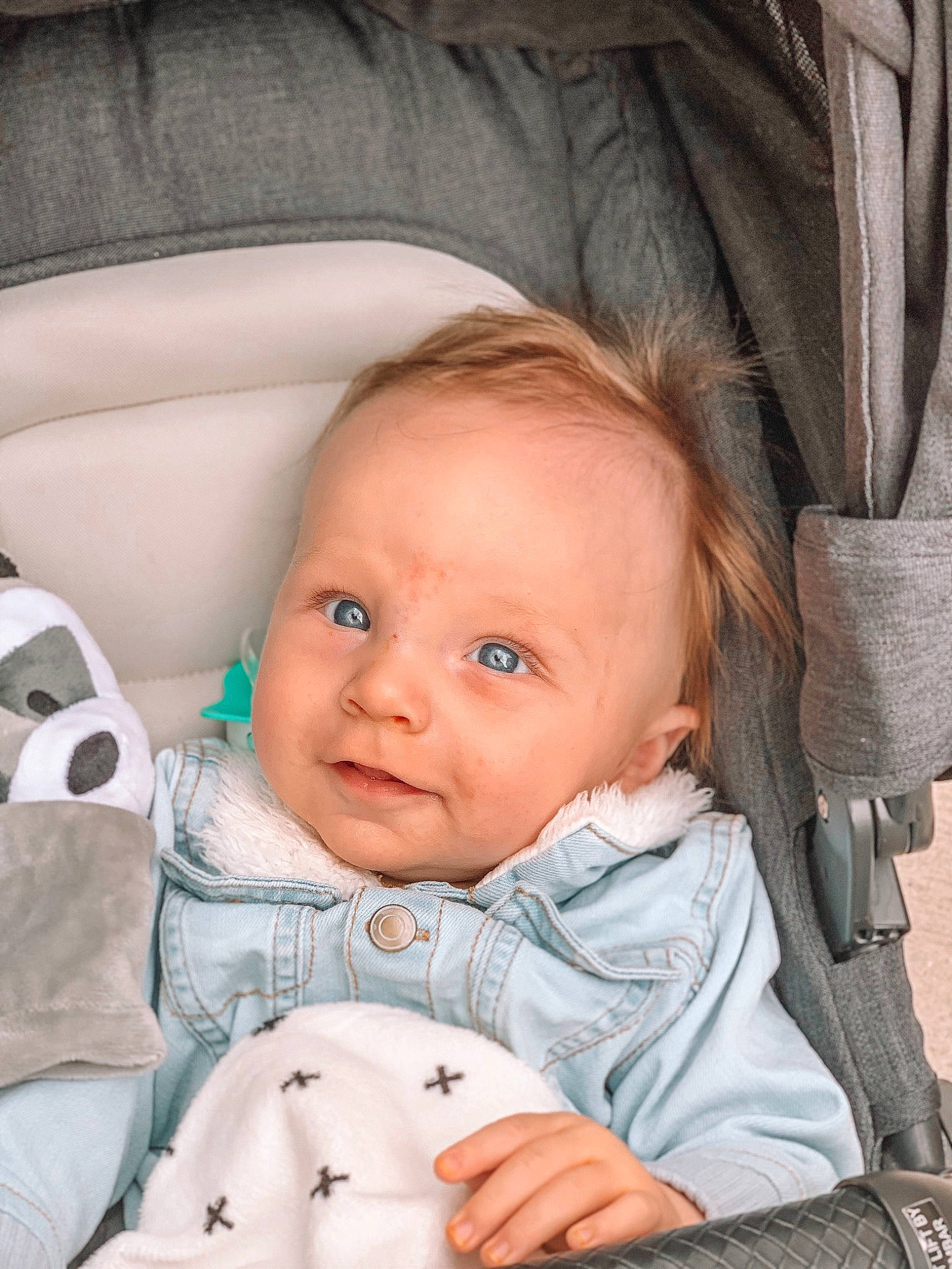 Storm is registered to the contest to win money with this photo: baby, baby_carriage, baby_products, cheek, child, eye, face, finger, head, nose, person, product, sitting, skin, smile, toddler
