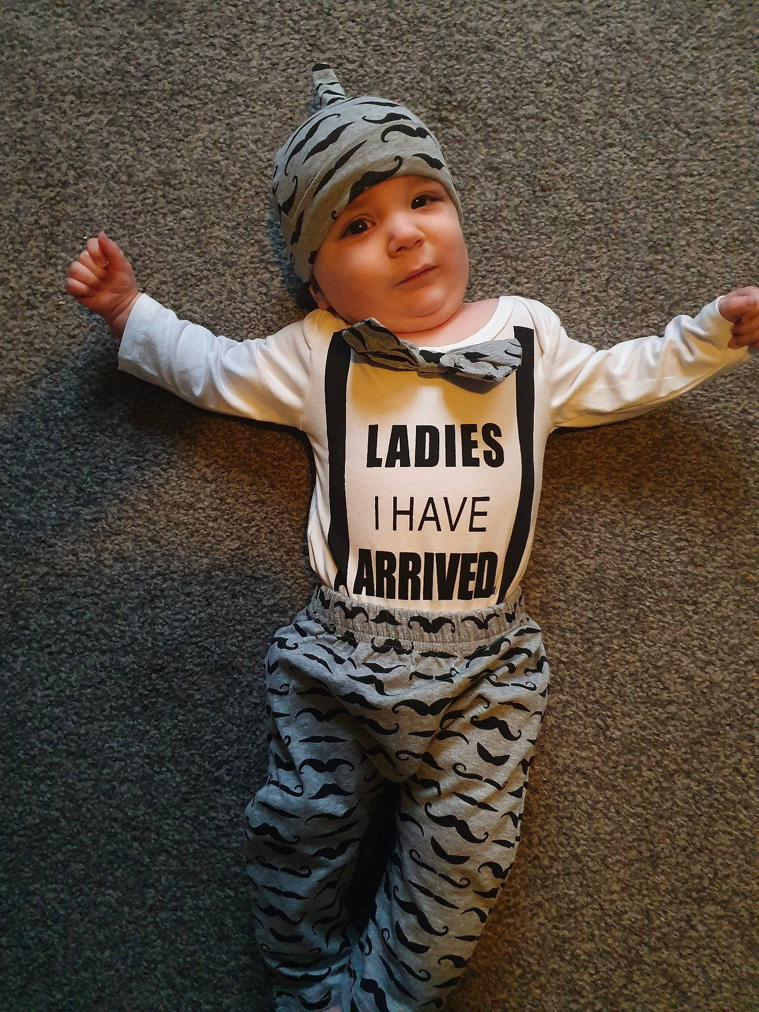 Zacharias is registered to the contest to win money with this photo: baby, baby_toddler_clothing, child, fun, happy, headwear, outerwear, person, sleeve, smile, t_shirt, toddler