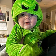 Aaron joined the competition — help win amazing prizes! baby, child, costume, green, hood, indoor, person, face, cute, smiling, plush, clothing, hand, portrait, young, infant, expression, home, stitching, spider