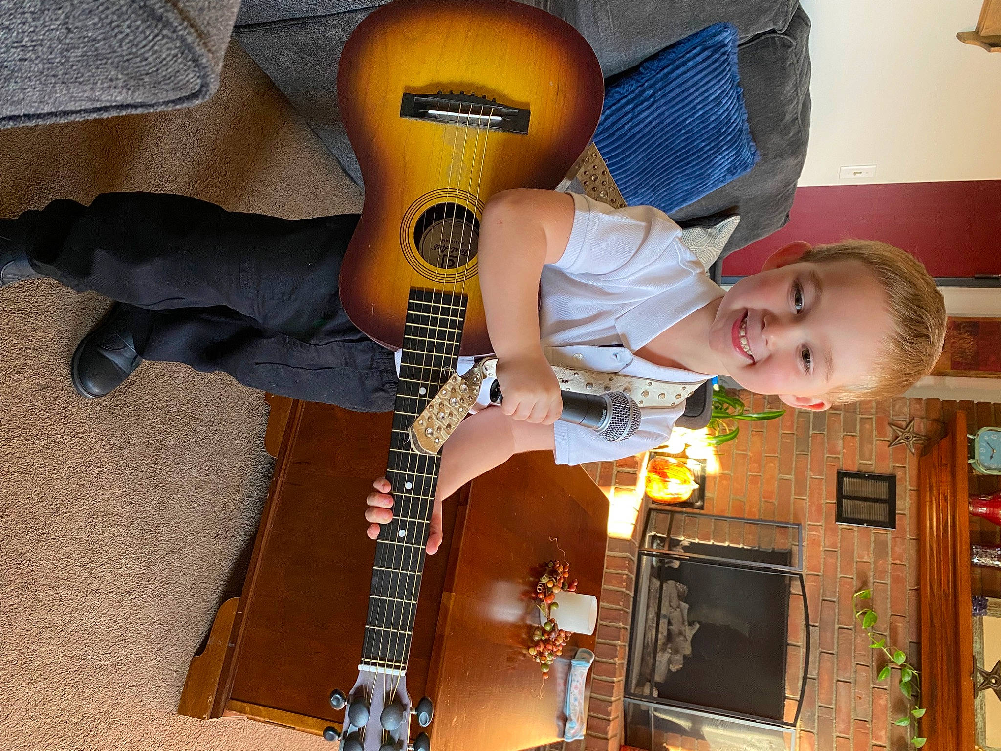 Axel is registered to the contest to win money with this photo: audio_equipment, baby_products, child, fashion_accessory, flooring, fun, home_appliance, joy, machine, person, personal_protective_equipment, play, room, smile, television, toddler