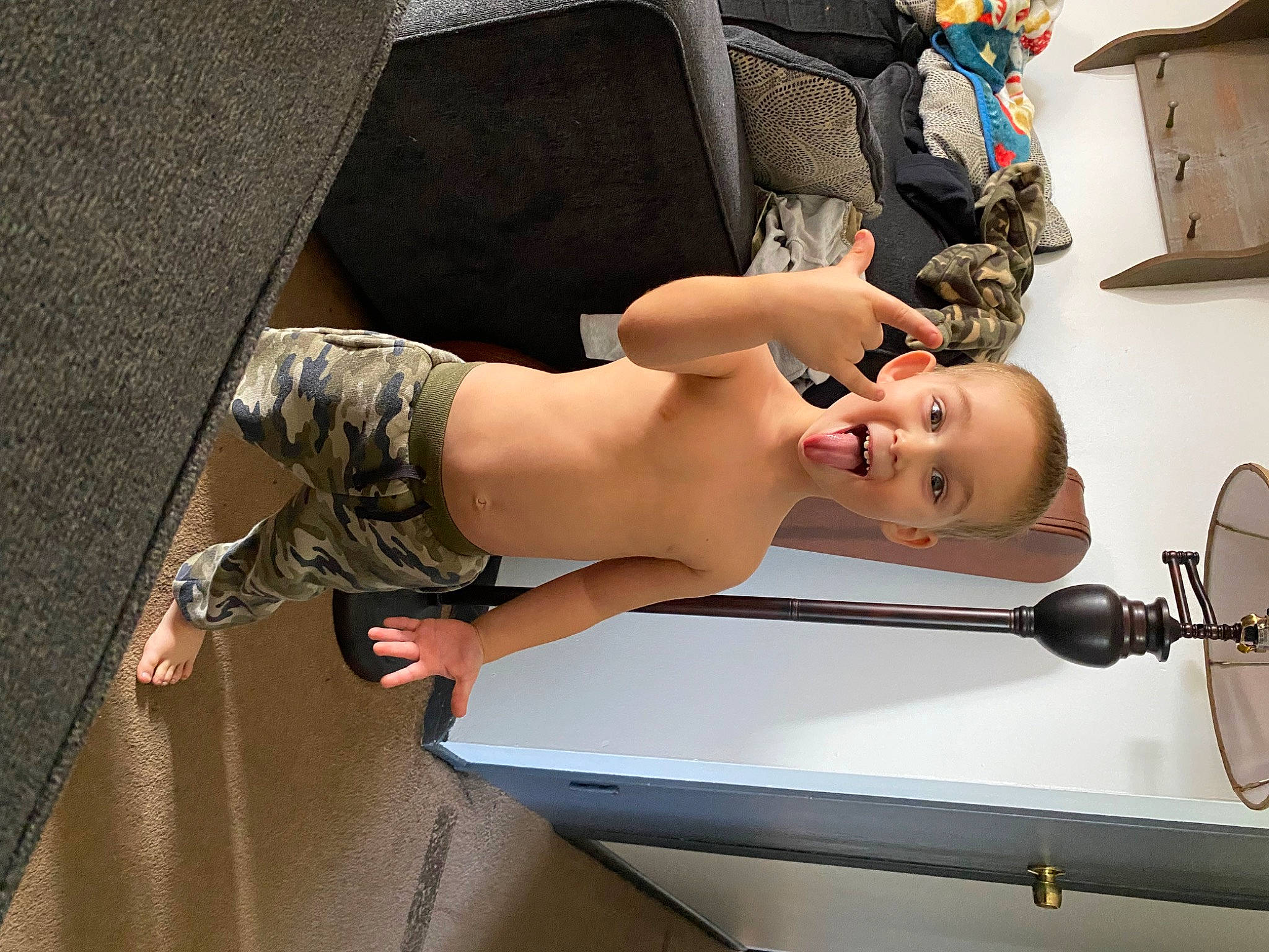 Axel is registered to the contest to win money with this photo: abdomen, art, barechested, bathing, chest, child, elbow, eyelash, eyewear, foot, fun, human_leg, joint, knee, person, shorts, shoulder, tattoo, thigh, toddler
