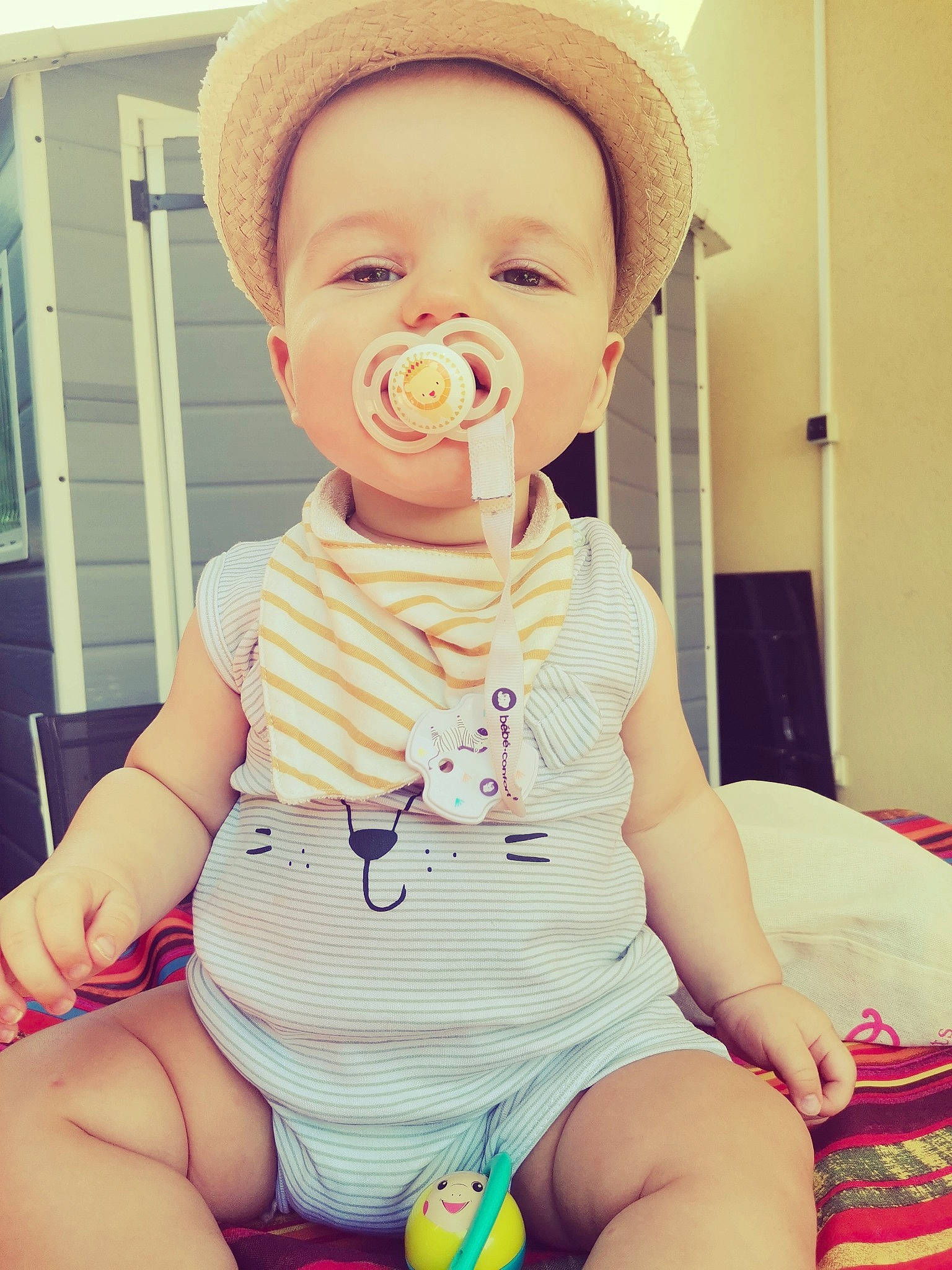 Liam participe au concours pour gagner de l'argent avec cette photo : baby, baby_toddler_clothing, cheek, face, finger, happy, hat, head, knee, mouth, neck, nose, person, pink, shorts, skin, sleeve, standing, thigh, toddler