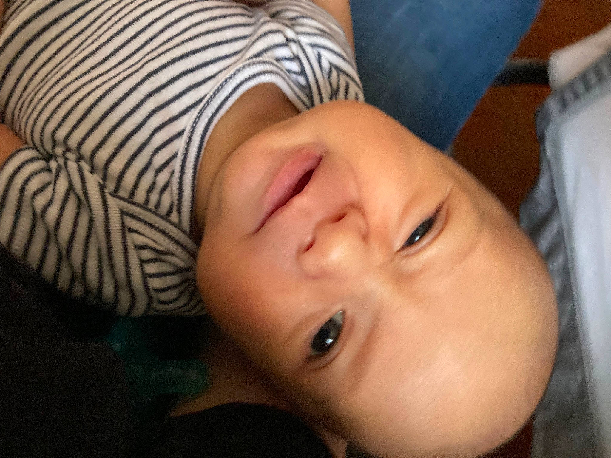 Cayden is registered to the contest to win money with this photo: baby, cheek, child, comfort, eyebrow, eyelash, facial_expression, finger, grass, happy, headgear, human_body, iris, lip, mouth, neck, nose, person, skin, smile