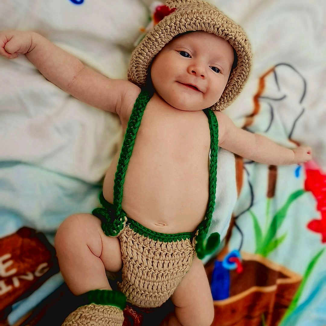Floyd joined the competition — help win amazing prizes! accessories, baby, bodypart, bonnet, cap, clothing, face, finger, glove, hand, happy, hat, head, newborn, person, photography, portrait, sitting, sleeve, smile