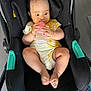 Inaya a rejoint le concours — aidez-le/la à gagner de superbes lots ! baby, black_seat, bottle, car_seat, child, cute, expression, feeding, feet, food_stains, hands, indoors, infant, legs, messy, person, seat, striped_clothing, wide_eyes, yellow_outfit