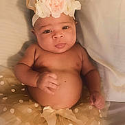 Azariah is registered to the contest to win money with this photo: baby, bed, clothing, cushion, dress, face, flower, flowerarrangement, flowerbouquet, furniture, hat, head, homedecor, newborn, person, petal, photography, plant, portrait, rose