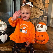 Areaza joined the competition — help win amazing prizes! child, toddler, baby, smiling, waving, halloween, pumpkin, jack_o_lantern, skeleton, costume, orange_clothing, headband, fireplace, stone, indoor, sitting, portrait, happy, seasonal_decor, family_photo