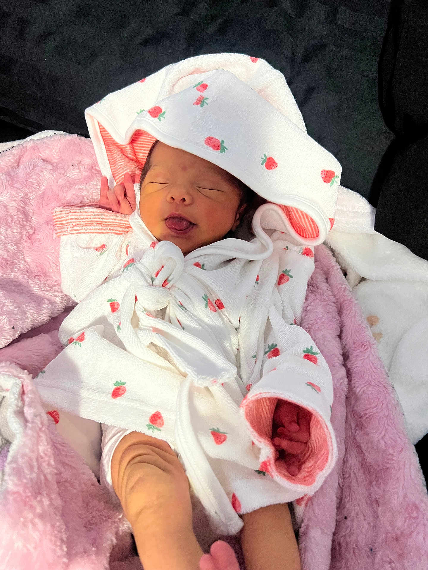 Laynee joined the competition — help win amazing prizes! newborn, baby, infant, sleeping, tongue_out, robe, strawberry_pattern, blanket, pink, white, cozy, cute, child, portrait, soft, wrapped, hand, foot, indoors, resting