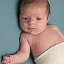 Gabriel participe au concours pour gagner de l'argent avec cette photo : baby, newborn, infant, face, eyes, arm, hand, skin, swaddle, blanket, portrait, studio, head, hair, lying_down, closeup, sleepy, cute, looking_at_camera, soft_background