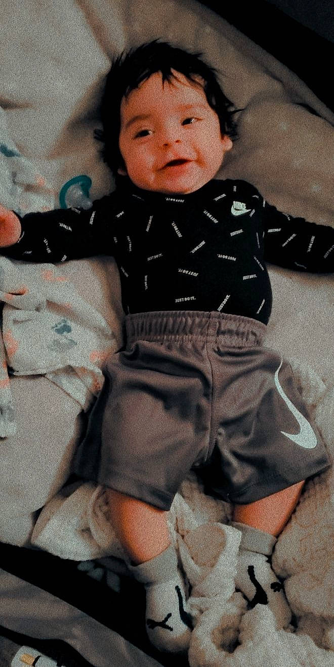 Ermias joined the competition — help win amazing prizes! baby, baby_products, baby_toddler_clothing, cheek, child, collar, comfort, finger, hand, happy, linens, pattern, person, sitting, skin, sleeve, smile, sock, thigh, toddler