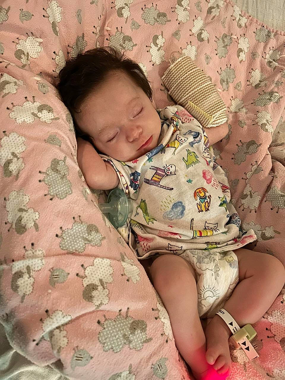 Presleigh is registered to the contest to win money with this photo: baby, baby_sleeping, baby_toddler_clothing, bedding, child, comfort, human, human_body, human_leg, linens, mammal, pattern, peach, person, room, sitting, skin, sleeve, textile, thigh