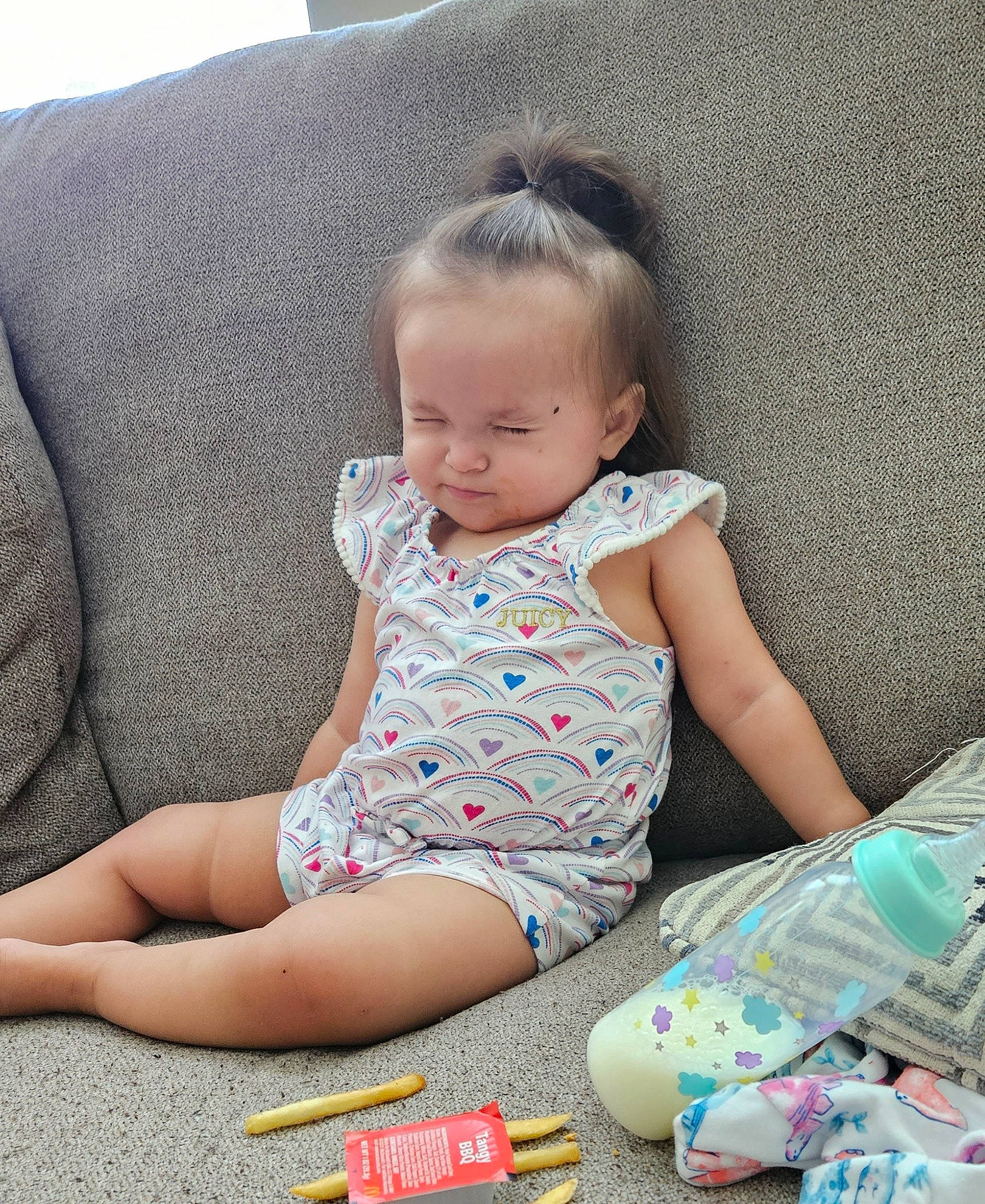 Ivelisse is registered to the contest to win money with this photo: baby, baby_toddler_clothing, child, comfort, couch, dress, flooring, fun, grass, linens, pattern, pen, person, play, sitting, skin, sleeve, t_shirt, textile, toddler