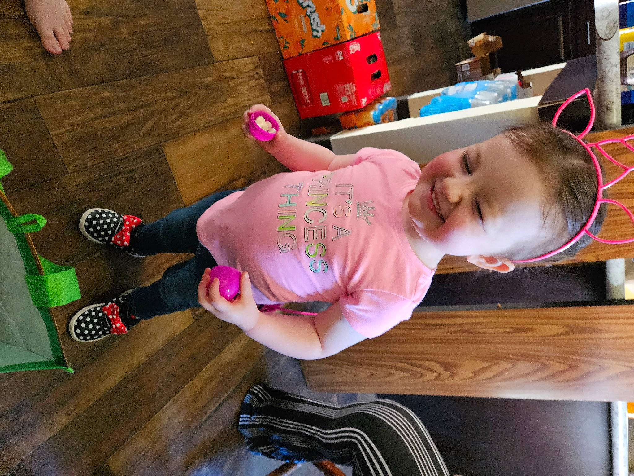 Lilly joined the competition — help win amazing prizes! abdomen, baby, baby_toddler_clothing, child, elbow, flooring, foot, fun, hardwood, human_leg, joy, knee, leisure, magenta, person, room, sandal, shorts, sock, thigh