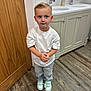Jace joined the competition — help win amazing prizes! child, boy, white_tshirt, light_jeans, sneakers, bathroom, wooden_door, floor, tile, sink, vanity, cabinet, soap_dispenser, curious_expression, standing, flooring, interior, casual_clothing, indoor, person