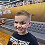 Jace is registered to the contest to win money with this photo: child, boy, smiling, haircut, barbershop, couch, sweater, bear_graphic, modern_interior, golden_wall, hairstyles, ceiling_lights, happy, portrait, indoor, fashion, casual_clothing, flooring, young_person, seated_person