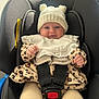 Kendal joined the competition — help win amazing prizes! baby, infant, car_seat, hat, knit_hat, leopard_print, clothing, child, safety_harness, cute, smiling, indoor, person, seatbelt, young_child, white_hat, warm_clothing, pacifier, legs, hands