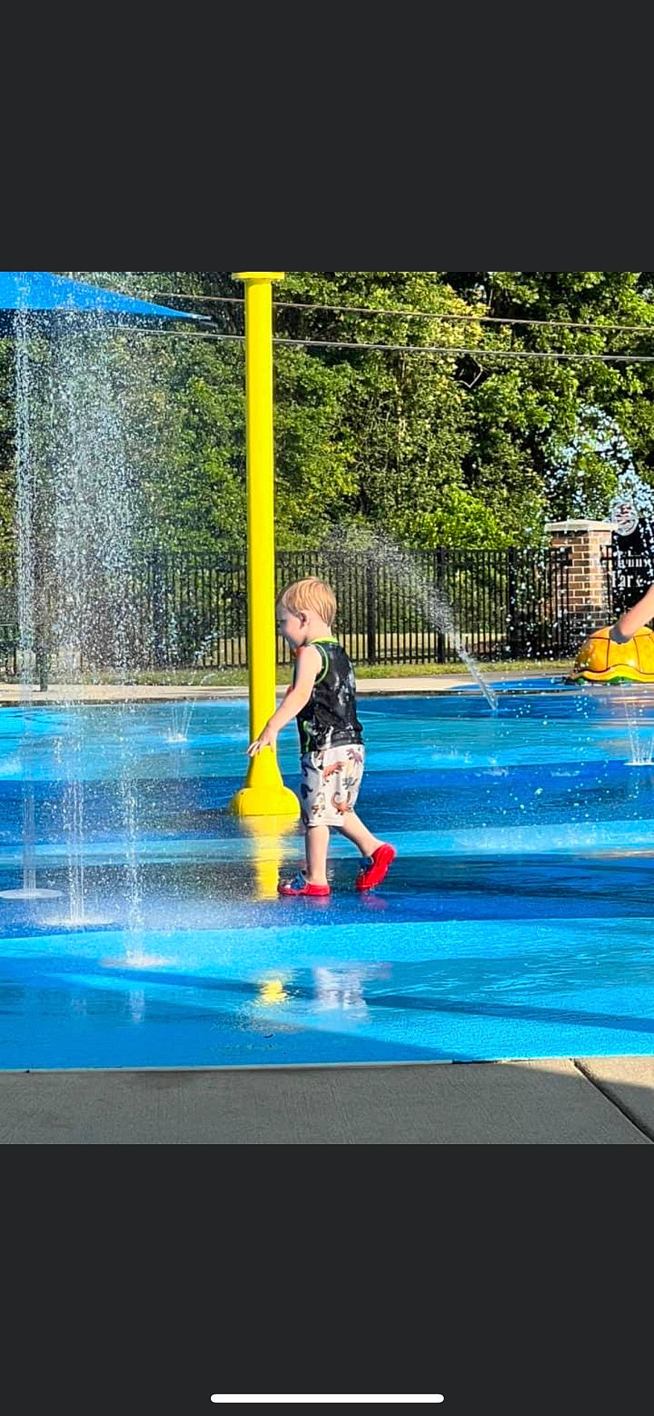 Hunter is registered to the contest to win money with this photo: aqua, blue, electric_blue, fountain, fun, games, leisure, leisure_centre, person, play, recreation, rectangle, reflection, swimming_pool, tints_and_shades, tourism, tree, water, water_feature, water_park