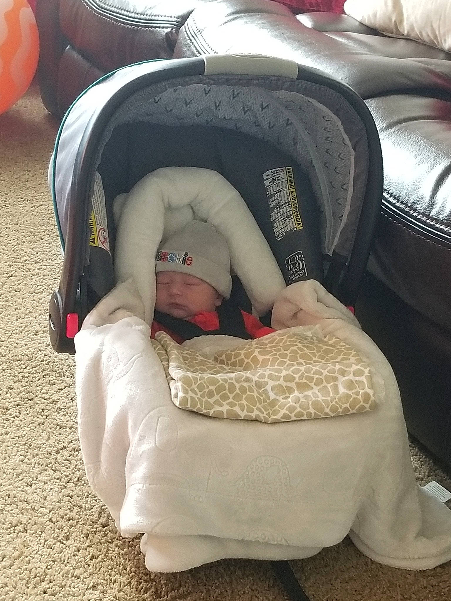 Luis Fernando is registered to the contest to win money with this photo: baby, baby_products, car_seat, child, comfort, headwear, person, product, sleep