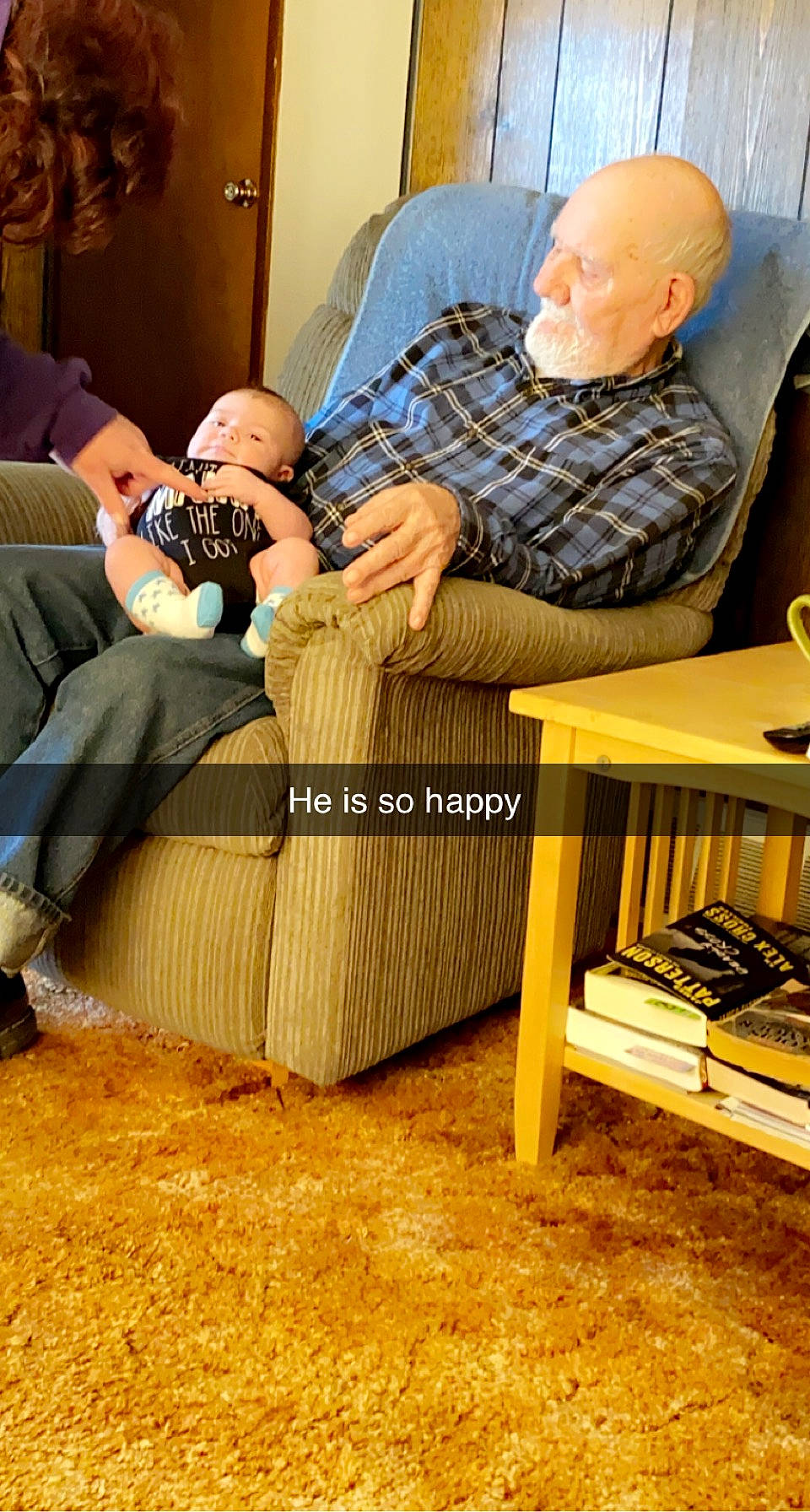 William is registered to the contest to win money with this photo: child, coffee_table, comfort, couch, event, eyewear, flooring, furniture, hardwood, leisure, living_room, person, product, rectangle, room, sitting, studio_couch, table, throw_pillow, wood