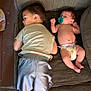 Janet is registered to the contest to win money with this photo: baby, toddler, child, couch, diaper, pacifier, shorts, tshirt, indoor, furniture, barefoot, relaxing, laying_down, home, people, face, leg, arm, skin, floor