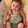 baby, infant, child, seat, baby_seat, harness, monkey_design, curious, cute, indoors, colorful, patterned_seat, child_care, young_child, looking, small_person, baby_clothing, soft_fabric, playful, comfortable
