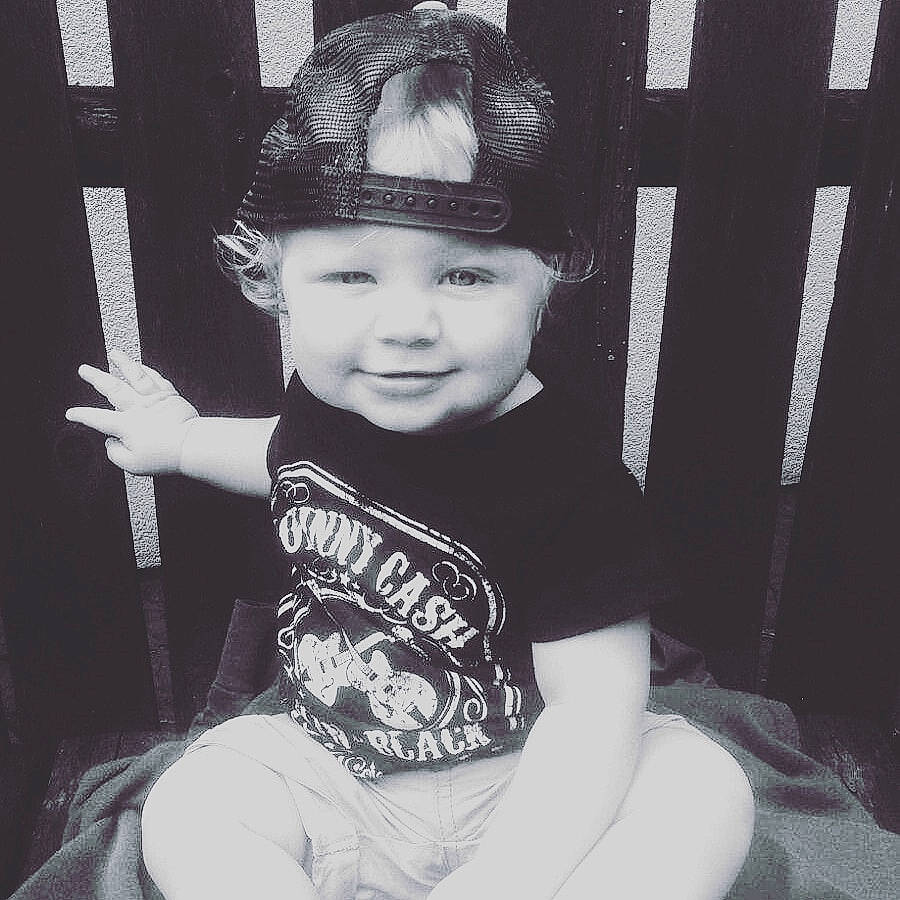 Laith is registered to the contest to win money with this photo: baby, black_and_white, black_hair, child, family, headgear, headwear, joy, monochrome, person, photograph, photography, smile, snapshot, style, toddler