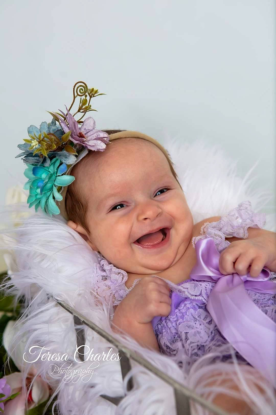 Macie is registered to the contest to win money with this photo: baby, baby_toddler_clothing, event, fashion_accessory, flash_photography, flower, fun, grass, hair_accessory, happy, headband, headgear, headpiece, iris, joy, person, petal, pink, plant, purple