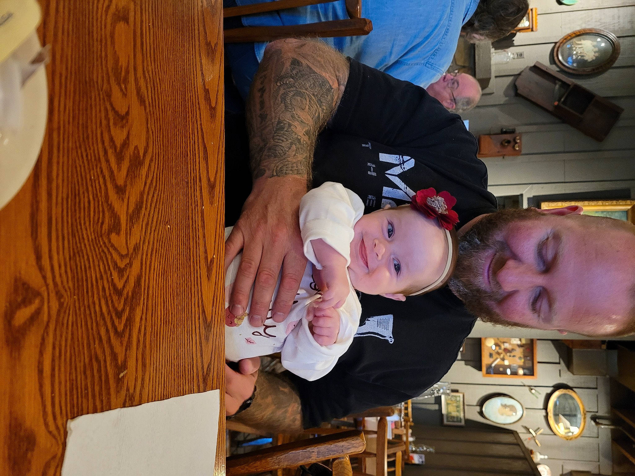 Macie is registered to the contest to win money with this photo: baby, chair, child, event, fun, hardwood, hat, joy, mechanical_fan, person, room, toddler, tree, wood