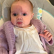 Elle joined the competition — help win amazing prizes! baby, infant, child, pout, purple_cardigan, white_shirt, striped_pants, baby_seat, cushion, indoor, checkered_floor, shadow, hand, face, eyes, head, expression, clothing, soft_texture, portrait