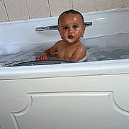 Sòul joined the competition — help win amazing prizes! baby, bathtub, bath, bubbles, child, ears, foam, gold_earrings, looking, portrait, soap, tile_wall, water, wet_skin, young_child, indoor, bathroom, sitting, curious, face