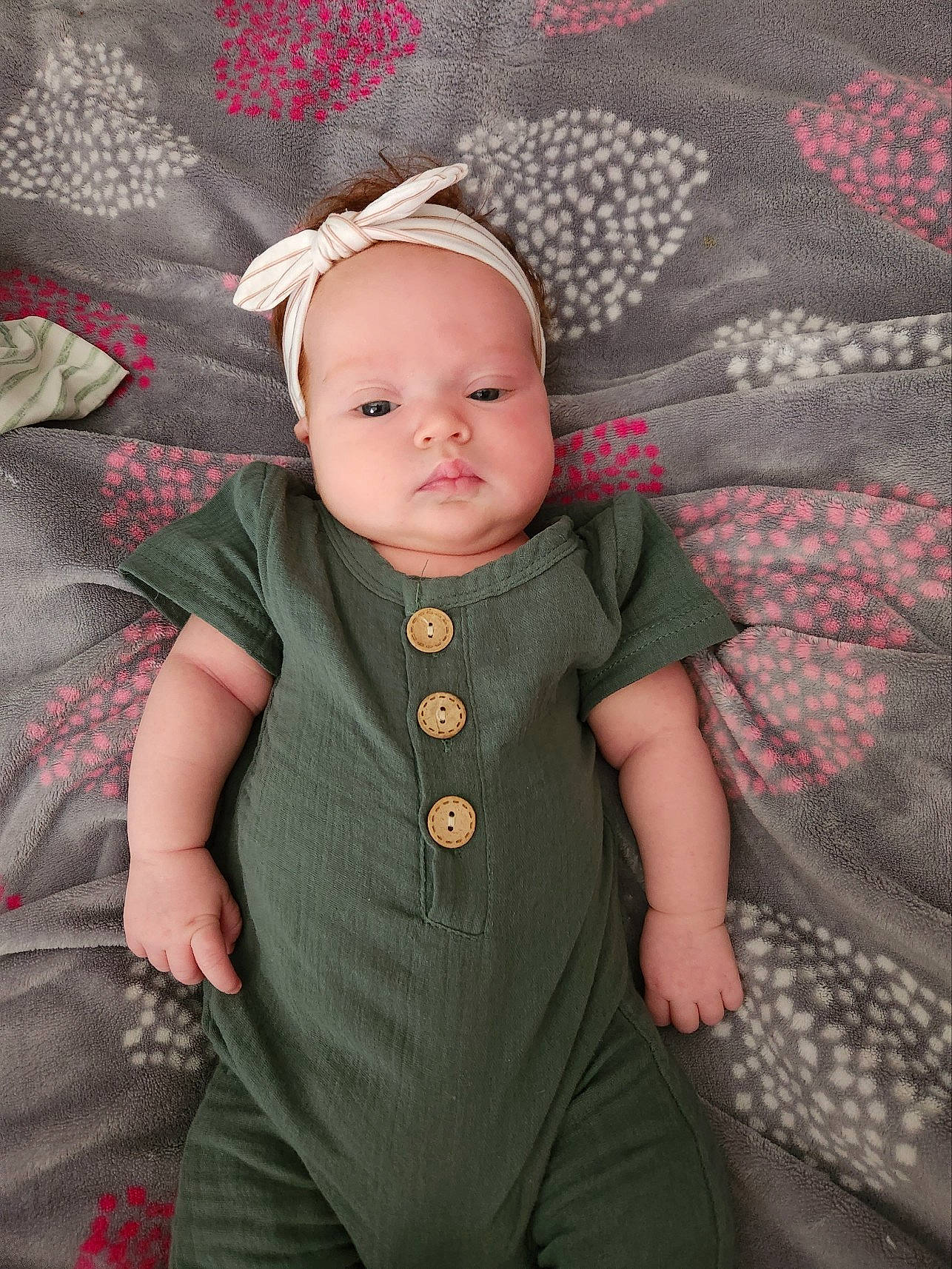 Payton joined the competition — help win amazing prizes! baby, baby_products, baby_toddler_clothing, cheek, child, collar, comfort, costume_hat, embellishment, fashion_accessory, grey, linens, magenta, pattern, person, room, sitting, sleeve, textile, toddler